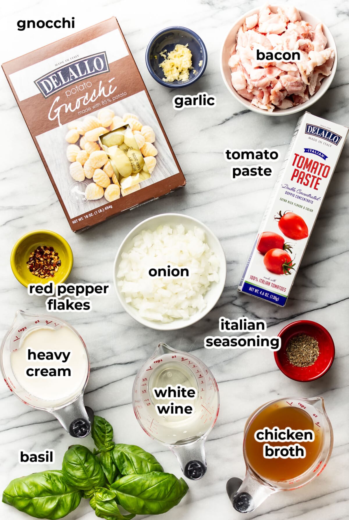 ingredients for spicy tomato gnocchi in prep bowls