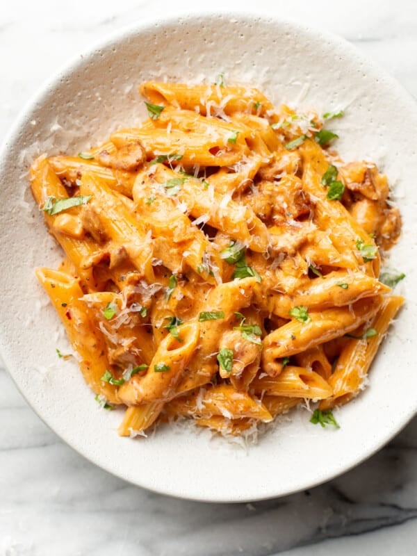 a bowl of spicy bacon tomato pasta
