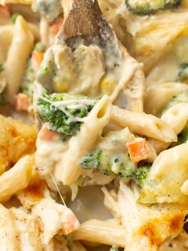 a serving spoon with chicken penne casserole
