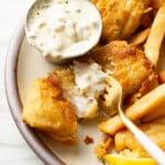 a plate with fish and chips and homemade tartar sauce