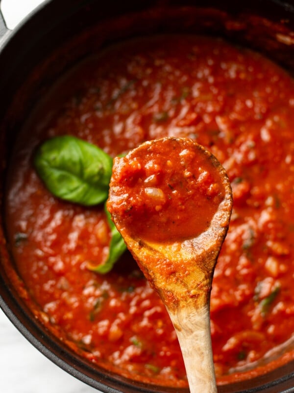 tomato sauce with a wooden spoon