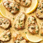 a skillet with pork tenderloin piccata