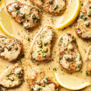 a skillet with pork tenderloin piccata