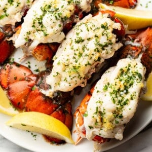a plate with garlic butter lobster tails