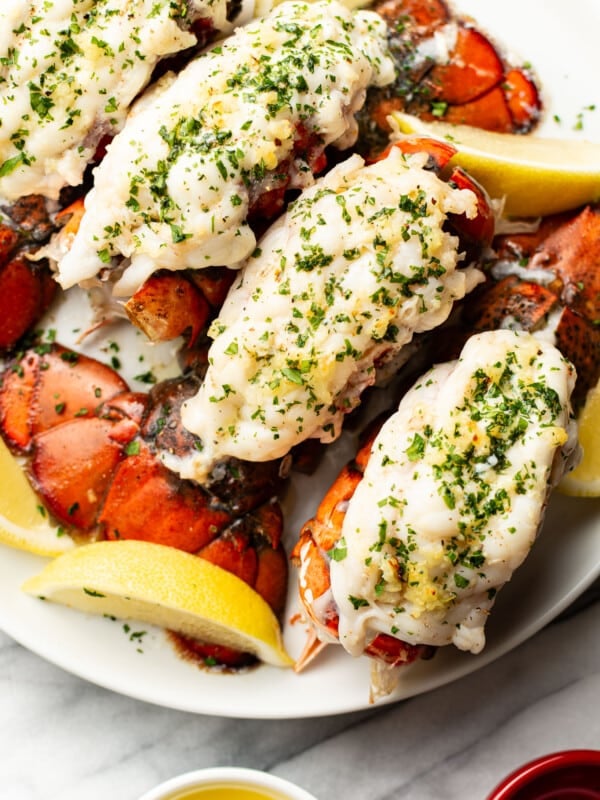 a plate with garlic butter lobster tails